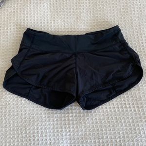 Lululemon Black Running Short with Notch Detail on Side, Vented Panel in Back